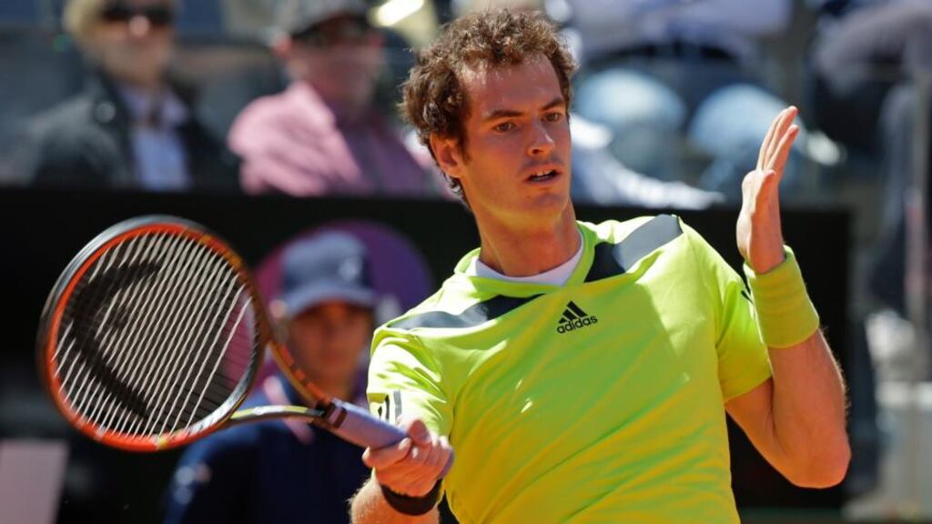 Andy Murray of Britain eyes the ball as he hits a return to Marcel Granollers. Photograph: Max Rossi/ Reuters