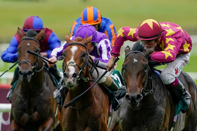 KILDARE, IRELAND - SEPTEMBER 11: Dylan Browne McMonagle riding Al Riffa (marron/yellow) win The Goffs Vincent O'Brien National Stakes at Curragh Racecourse on September 11, 2022 in Kildare, Ireland. (Photo by Alan Crowhurst/Getty Images)