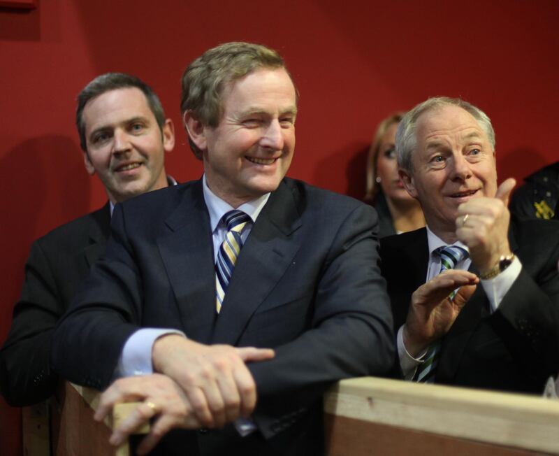 Fine Gael leader Enda Kenny celebrates with Michael Ring at the Mayo Constituency Count Centre as four Fine Gael candidates out of five in total were elected. Photograph: Bryan O'Brien 