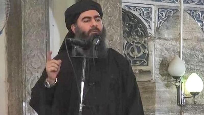 A file frame from a video released by the Islamic State purportedly shows  Abu Bakr al-Baghdadi giving a speech.