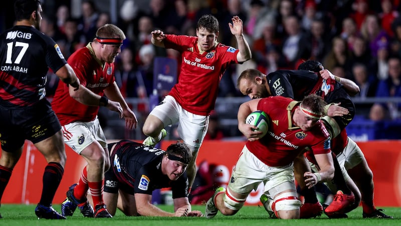 Munster's John Ryan and Neil Cronin with Gavin Coombes as he is tackled. Photograph: Ben Brady/Inpho 