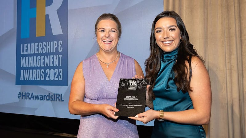 Rosarii Mannion, awards judge, presents the best flexible working strategy award to Rachael Quinlan, CluneTech