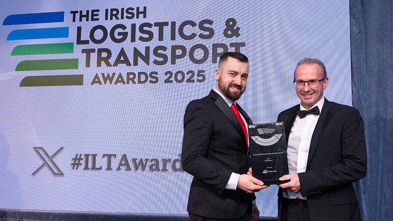 Adam Zurawski, transport & logistics recruitment manager at Driving Force, presents the overall logistics & transport excellence award to Stephen Kent, Bus Éireann.