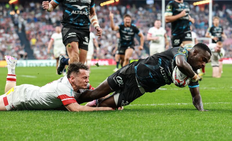 Gabriel N'Gandebe scores Montpellier's first try in Friday's Challenge Cup final despite the best efforts of Ulster's Michael Lowry. Photograph: Dan Sheridan/Inpho