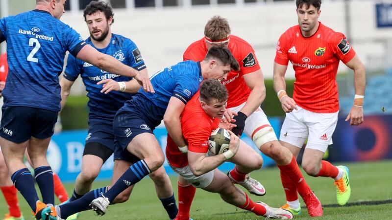 Munster’s Chris Farrell is tackled by Ross Byrne of Leinster during the Guinness Pro 14 Final at the  RDS. Photograph: Billy Stickland/Inpho