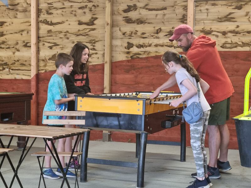 Ed Aldeweireldt playing table football with three of his children - Ciara, Rian and Fiona - at the International Outdoor Adventure Centre near Rosslare in Co Wexford
