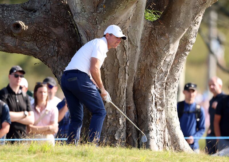 Rory McIlroy of Northern Ireland plays a left-handed shot as he plays his second shot on the 11th hole. Photograph: Warren Little/Getty