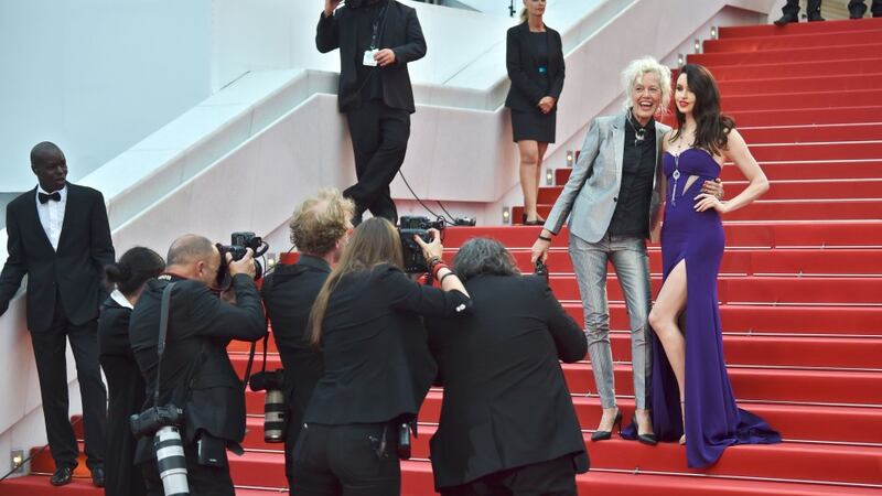 German fashion photographer Ellen von Unwerth (L) and British model Emma Miller pose on the red carpet in Cannes. Photographer: AFP/Bertrand Langlois