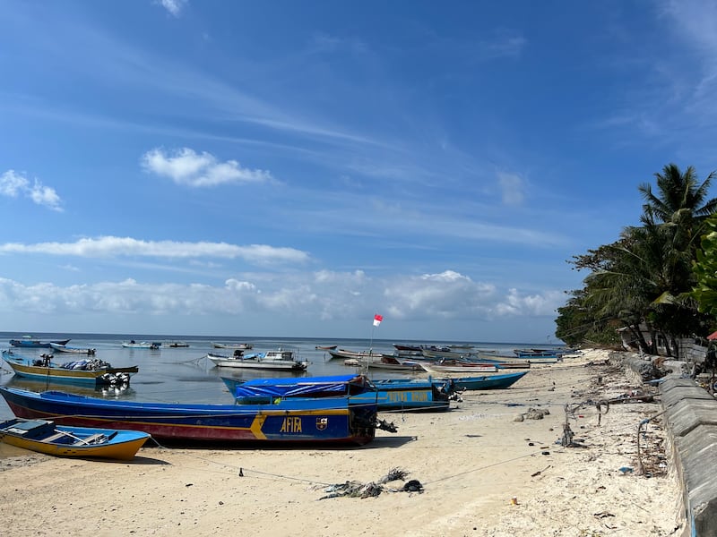 Boats along the shore at Run, at the Spice or Maluku Islands, Indonesia. Photograph: Gemma Tipton