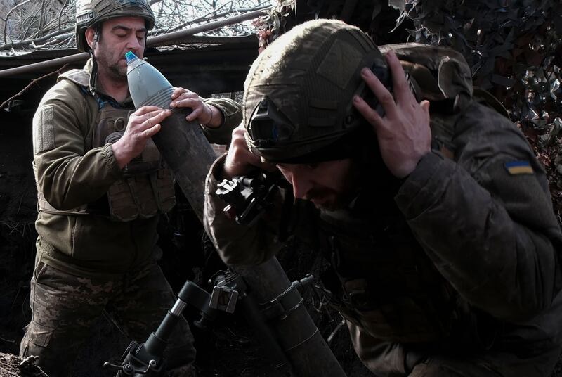 Ukrainian soldiers at an undisclosed location in the Donetsk area prepare to shoot a mortar in the direction of Avdiivka. Photograph: Vitalii Nosach/EPA