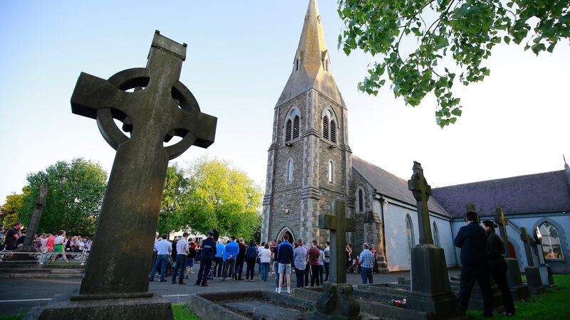 Crowds gather at St Brigid’s Church in Dunleer, Co Louth to hold a candlelit vigil for Cameron Reilly, whose body was found in a field close by.   Photograph: Nick Bradshaw
