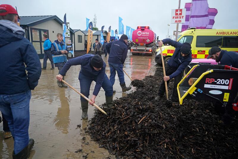 Extra mulch is laid to cope with wet conditions at the National Ploughing Championships. Photograph: Niall Carson/PA Wire 