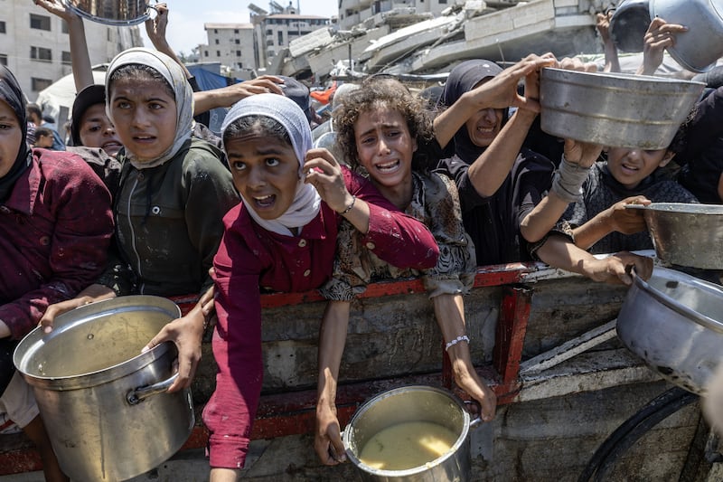 Palestinians at a charity kitchen in Gaza City on Saturday. Photograph: Saher Alghorra/The New York Times