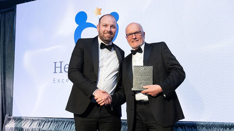Padraic Geraghty, senior account executive at HSI Skillko, presents the safety culture transformation award - large to Frank Shiel, ESB Engineering and Major Projects