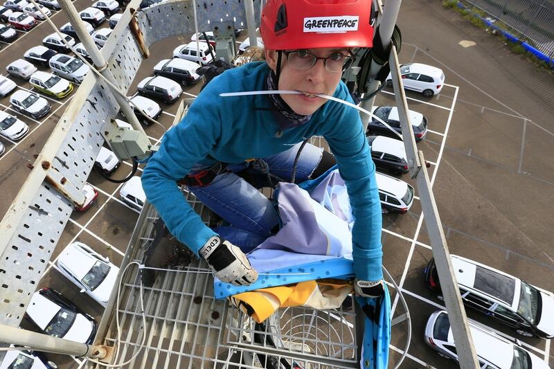 Greenpeace boards ship in England in bid to stop delivery of VW cars