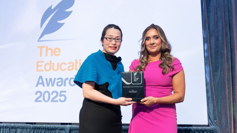 Yuxin Wang, awards judge, presents the student engagement & communications award to Niamh O'Connor, University of Limerick