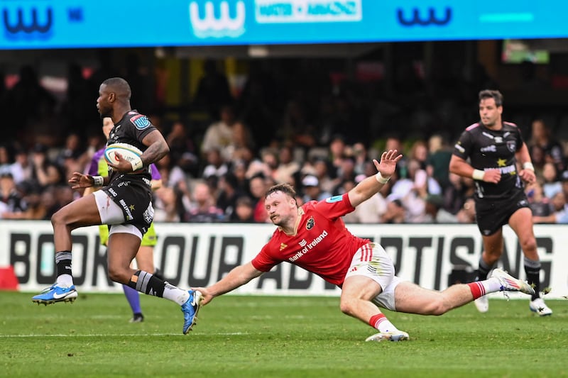 Sean O’Brien of Munster tries to tackle Aphelele Fassi of Sharks at Kings Park, Durban on October 26th, 2024. Photograph: Darren Stewart/Inpho