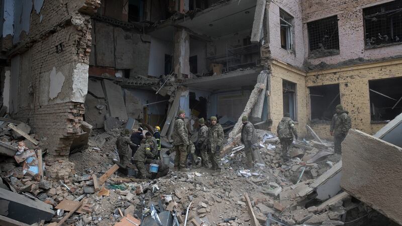 Military personnel at a barracks used by Ukrainian airborne troops that was attacked by Russian forces  in Mykolaiv. Photograph: Tyler Hicks/The New York Times