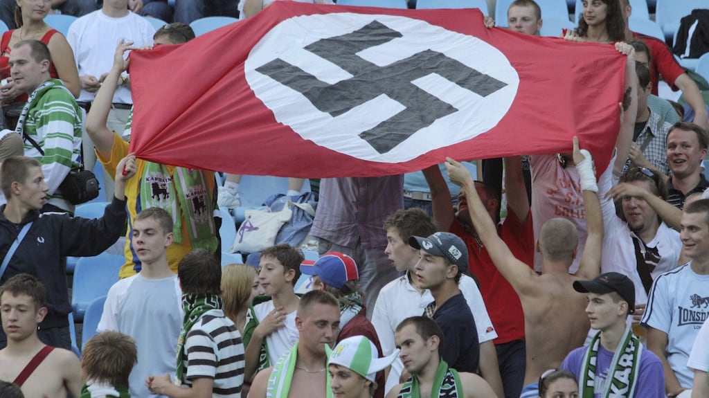 Supporters of Karpaty Lviv hold a Nazi flag at a soccer match against Dynamo Kiev in Kiev in 2007. Photograph: Reuters