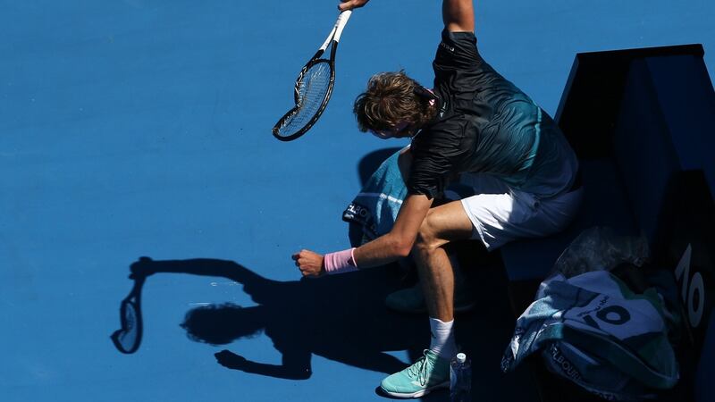 Zverev smashes his racquet during a break in action. Photo: Hamish Blair/EPA