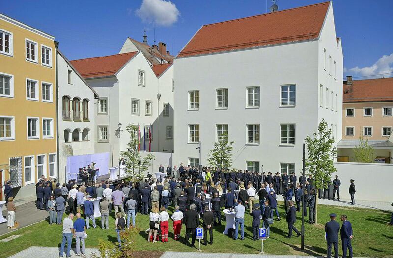 Police officers and guests attend the station's opening ceremony. Photograph: Manfred Fesl/AFP via Getty Images/Austria Out