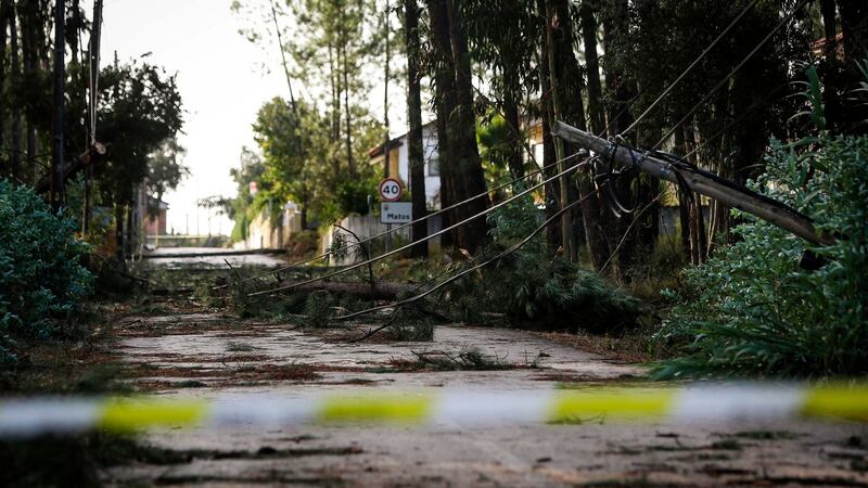 A road is closed after an electric pole fell during  storm Leslie. Photograph: Getty