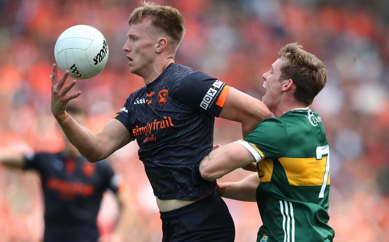 Kerry's Gavin White tackles Rian O'Neill of Armagh. Photograph: Leah Scholes/Inpho