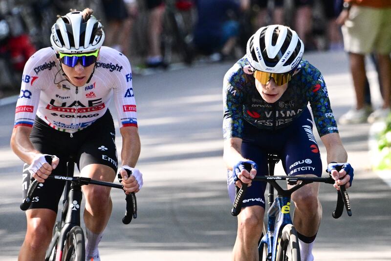 Tadej Pogacar (left) and Jonas Vingegaard cycle up the San Luca ascent near Bologna in the final kilometers of the second stage of the Tour de France. Photograph: Bernard Papon/AFP via Getty Images