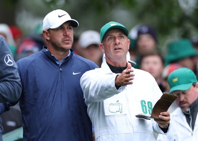 Brooks Koepka and his caddie Ricky Elliott line up at the fourth tee during the Masters at Augusta in 2023. Photograph: EPA - European Pressphoto Agency