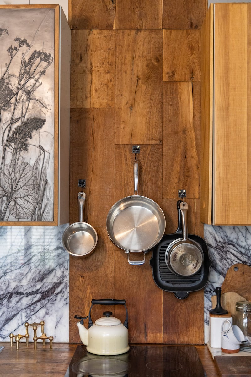 Oak flooring used to create wall feature, tying decorative scheme together
