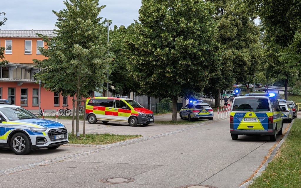 Cars by Police and rescue personnel are parked near the secondary school Schongau, in the southern German state of Bavaria, where several people have been wounded and a suspect arrested in an attack. Photograph: Christoph Peters/Getty Images