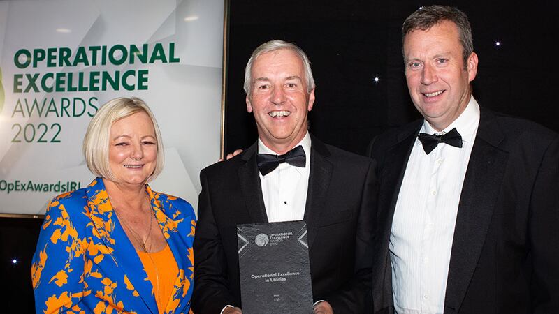 Brian Coll, Judging Co-ordinator, presents the Operational Excellence in Utilities award to Leon Brinkley & Carol Ryan, ESB.