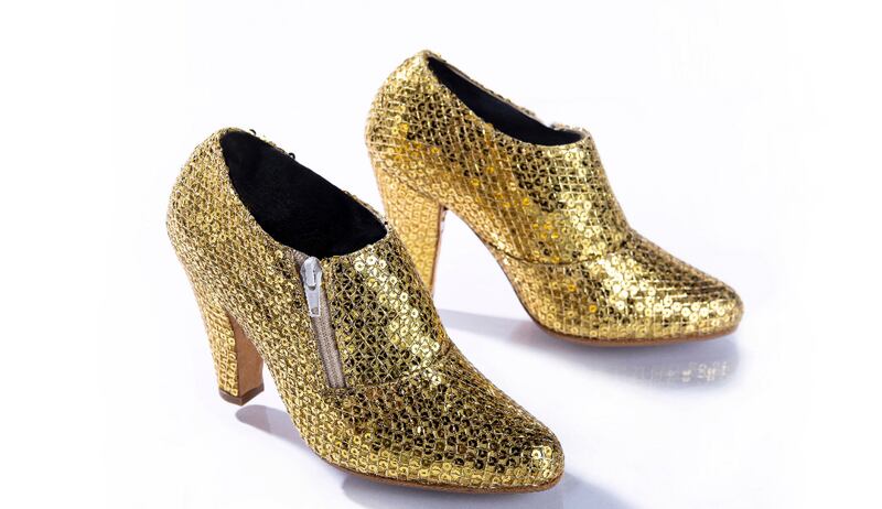 Prince wore these gold metallic boots during his 2010-2011 Welcome 2 America tour. Photograph: Tony Sylvers/© 1985-2021 The Estate of Prince Rogers Nelson. All rights reserved