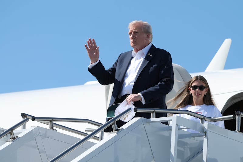 US president Donald Trump walks off Air Force One with his granddaughter, Kai Trump, after arriving at the Republic Airport on September 26, 2025 in Farmingdale, New York. Photograph: Anna Moneymaker/Getty