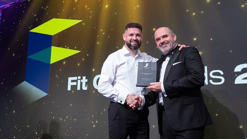 Nigel Watkins, commercial director UK & ROI at Rockfon, presents the fit out project of the year - healthcare award to Shane Bennett, T&I Fitouts