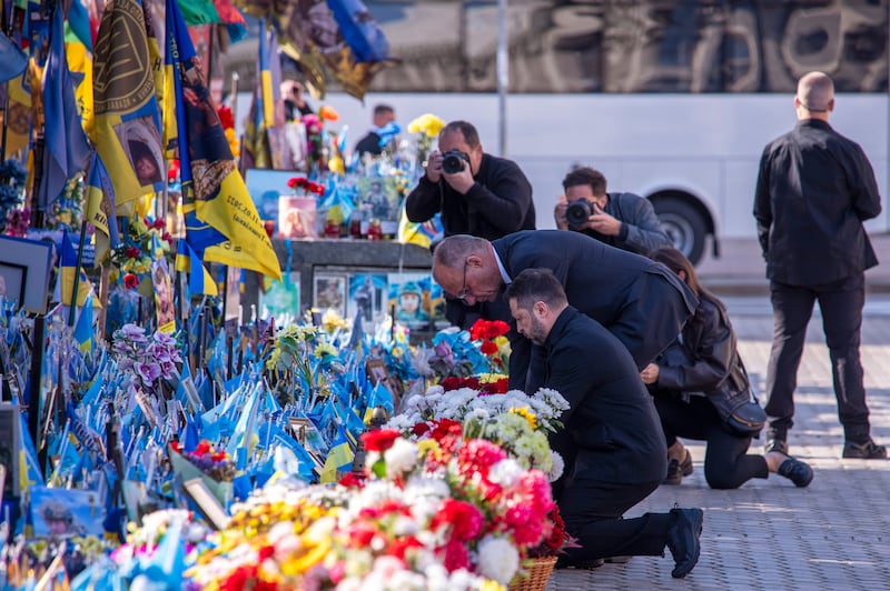 Ukrainian president Volodymyr Zelenskiy and German chancellor Friedrich Merz attend a ceremony at the memorial of fallen Ukrainian soldiers in Kyiv, Ukraine. Photograph: Dan Bashakov/AP