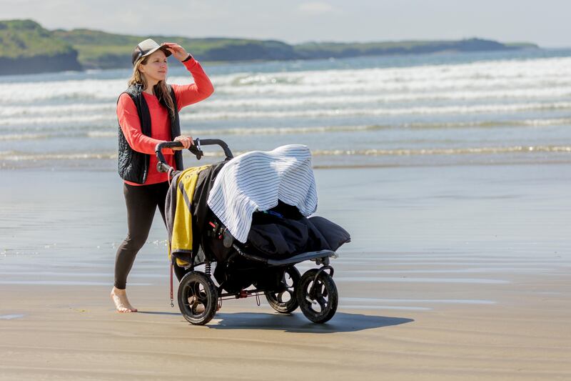 Easkey Britton with her 10 month old twins on Rossnowlagh Beach. Photograph: James Connolly
