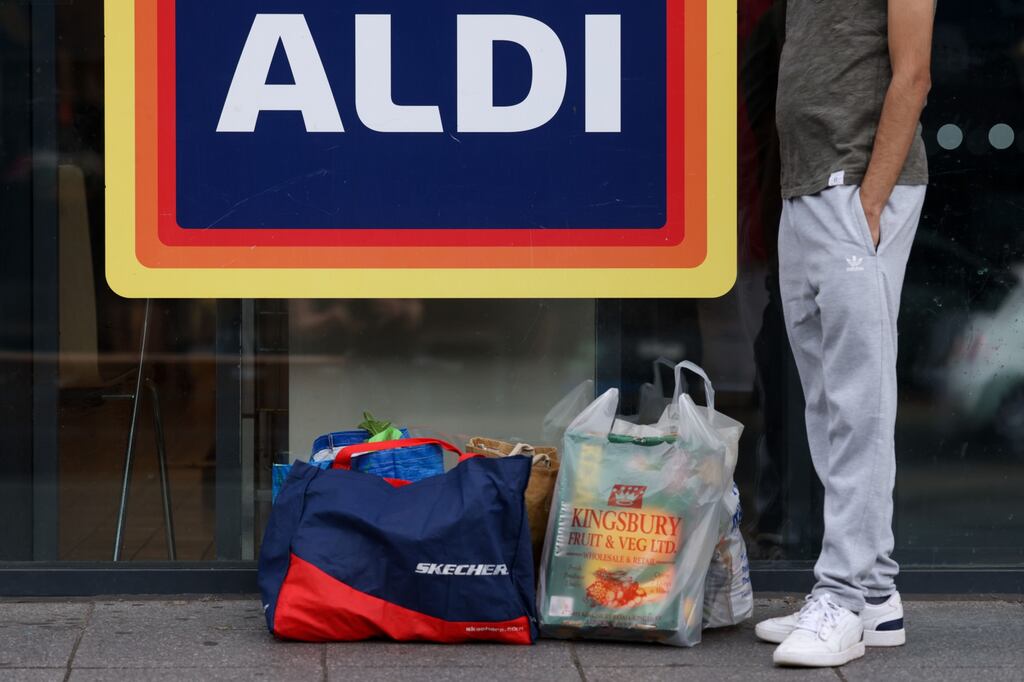 The survey of 1,000 adults, on behalf of the firm, said 50% of those polled overspend, shop more frequently or buy what they don't need to qualify for money-off vouchers. File photograph: Bloomberg
