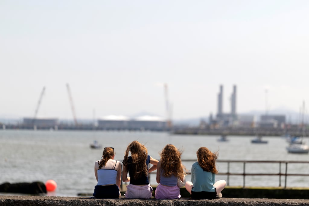 A group of girls sun themselves on the Clontarf promenade in Dublin. Photograph: Chris Maddaloni