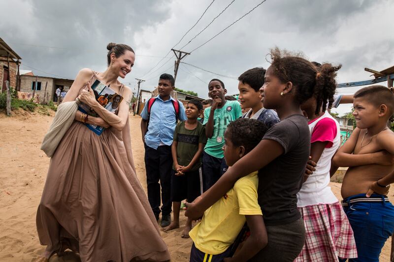United Nations High Commission for Refugees Angelina Jolie speaks with children in Riohacha, Colombia in 2019. Photograph: Andrew McConnell / UNHCR via Getty Images