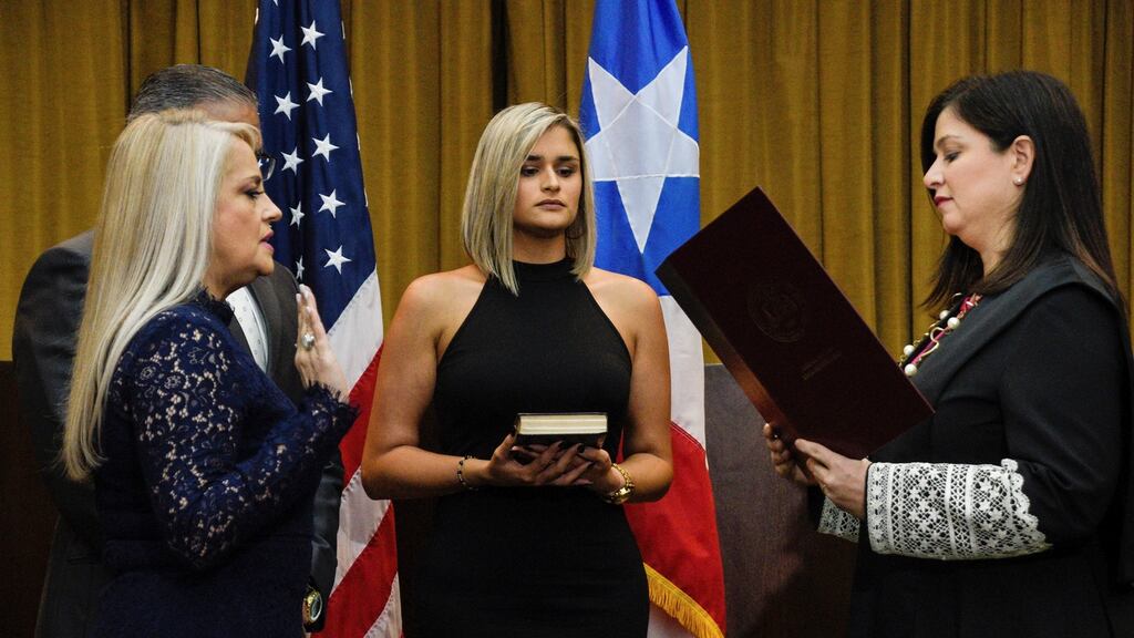 Wanda Vazquez, former secretary of justice, is sworn in as Governor of Puerto Rico by supreme court justice Maite Oronoz. Photograph: Reuters