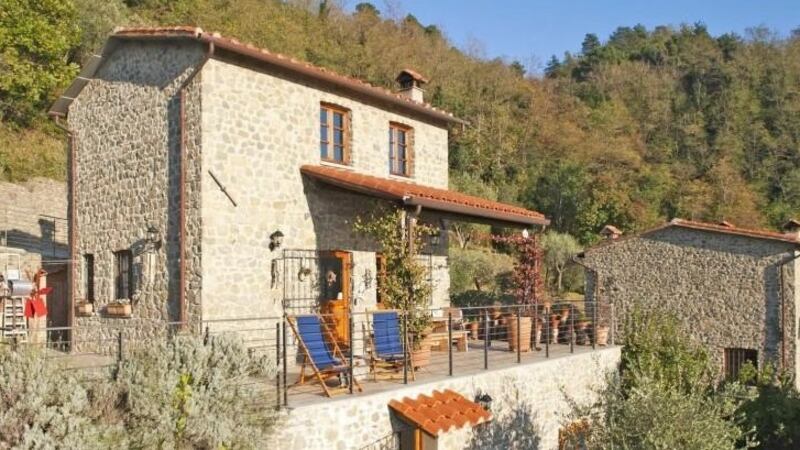 Tuscan home with garden set in chestnut and olive groves overlooking a valley,  100sq m house is traditional in style with exposed stone walls