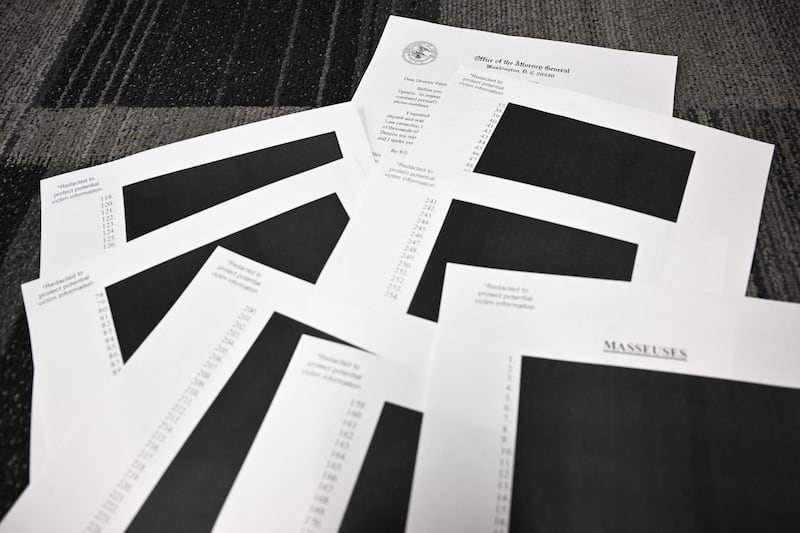 Redacted documents after the US justice department began releasing the long-awaited records from the investigation into the late sex offender Jeffrey Epstein. Photograph: Mandel NGAN/AFP via Getty Images