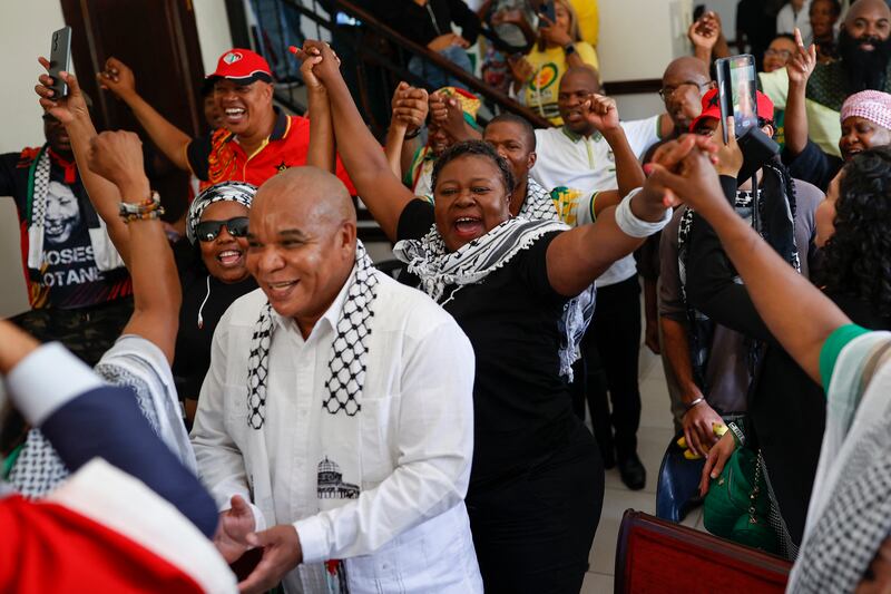 Pro-Palestinian supporters react in celebration at the Embassy of Palestine in Pretoria after watching the International Court of Justice delivering its decision in the Hague. 