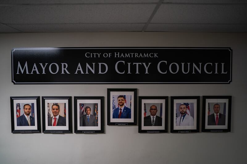 Photographs of Hamtramck mayor Amer Ghalib and city council members are seen in a hallway at the City Hall in Hamtramck, Michigan. Photograph: Salwan Georges/The Washington Post via Getty Images