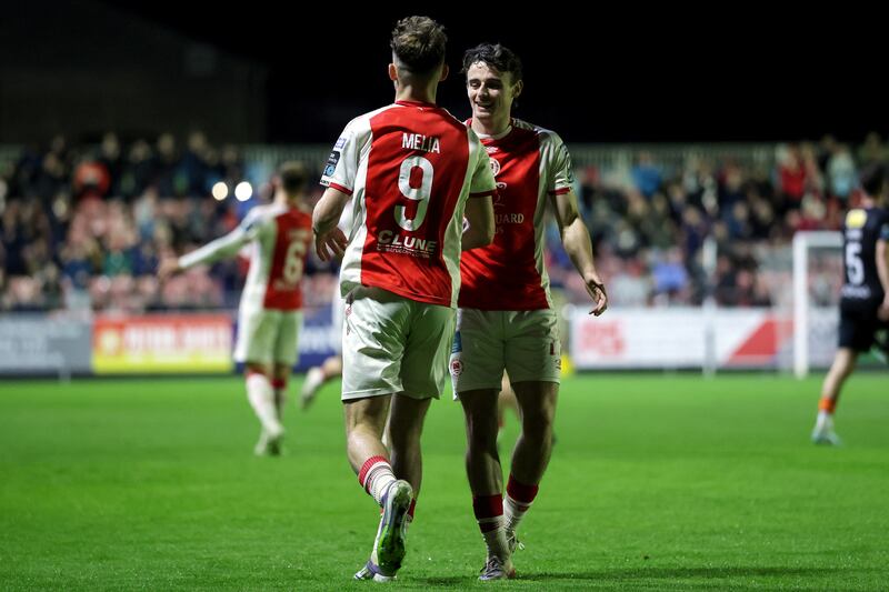 Mason Melia celebrates scoring his second goal with St Pat's team-mate Simon Power. Photograph: Laszlo Geczo/Inpho