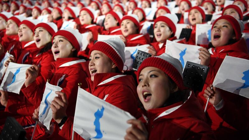 North Korean athletes sing and hold the unification flag depicting a unified Korean peninsula before the start of the opening ceremony of the Winter Olympics in Peongchang. Photograph:  James Hill/The New York Times