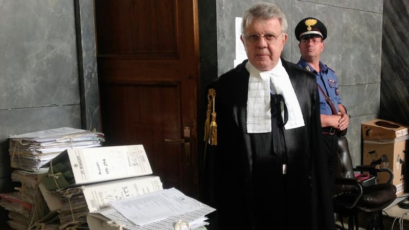 Italy’s former prime minister Silvio Berlusconi’s defence lawyer, Longo, poses at court. Photograph: Alessandro Garofalo/Reuters