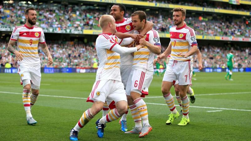 Scotland’s Shaun Maloney (number 6) celebrates with his team-mates after scoring the equalising goal  in the Euro 2016 Group D qualifier against Republic of Ireland at the Aviva Stadium. Photo: Nick Potts/PA