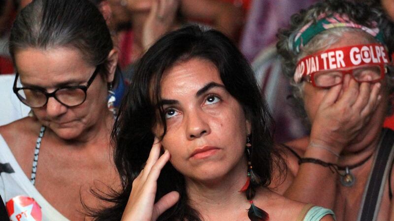 Supporters of Brazil’s president Dilma Rousseff watch a screen displaying the chamber of deputies’ debate on her possible impeachment,  in Rio de Janeiro , Brazil on Sunday. Photograph: Luiz Eduardo Perez/EPA